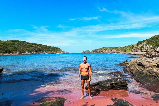 3-hour Small Group Buzios Peninsula Open Air Trolley Tour - Forno Beach red sand, calm water, and the 40-minute reality