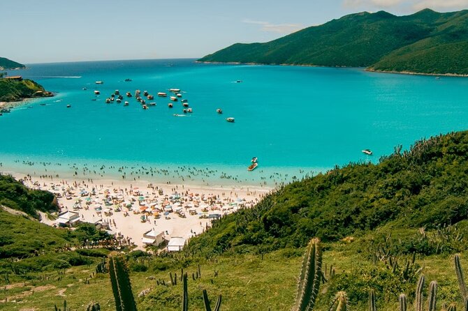 A Day in Arraial do Cabo Guided Tour - Praia dos Anjos: main port energy, calm water, and sunset views