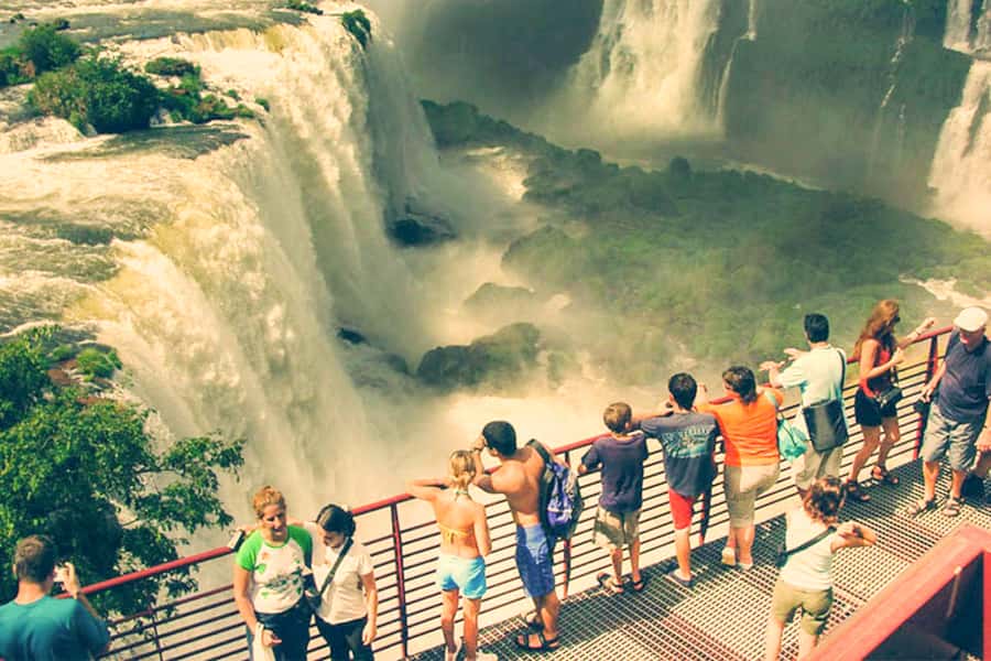 From Puerto Iguazu: Brazilian Falls with Boat Adventure - The electric car ride and forest walk into Iguaçu National Park