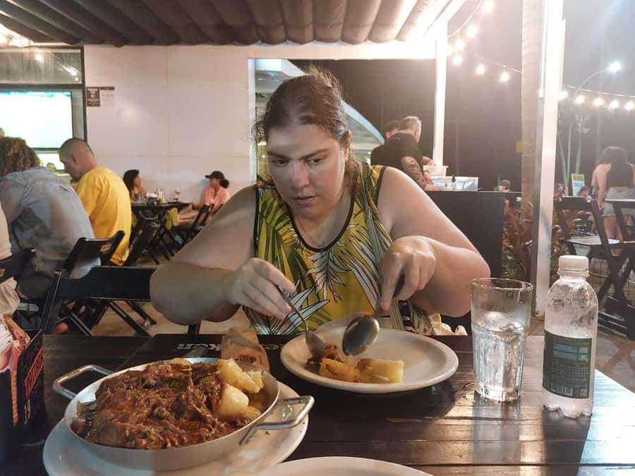 Rio de Janeiro: Barra da Tijuca Walk & Food Tour with Drinks - Welcome caipirinha and the restaurant lineup along Olegário Maciel Avenue