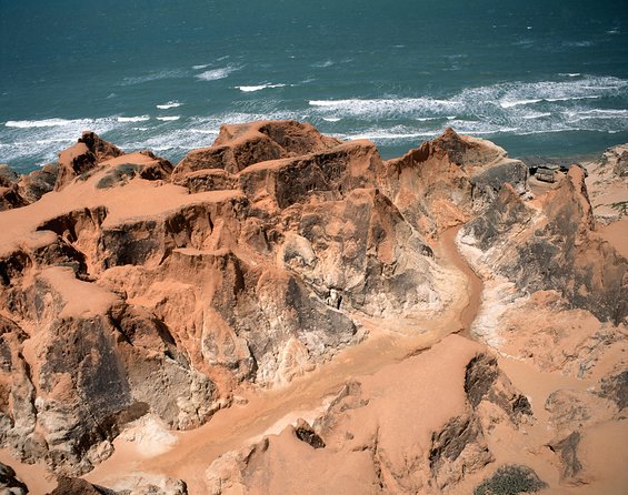 The colorful sands of Morro Branco beach - Full Day Tour - Morro Branco Bay And The Film-Famous Color Sand Factor